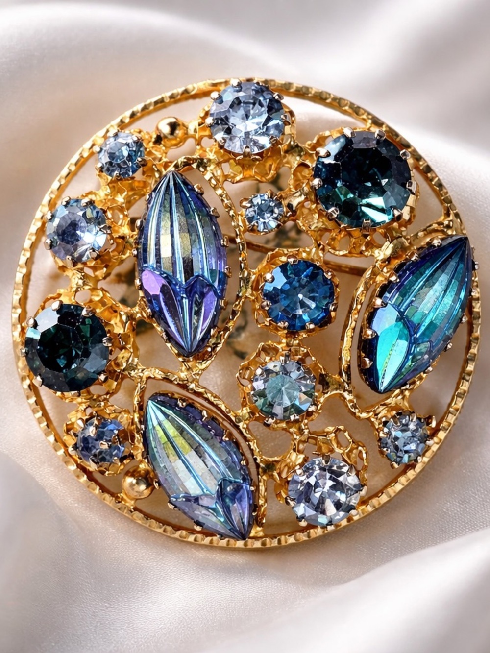 Vintage pin set with peacock blues! Gold tone setting! Marked Austrian made!